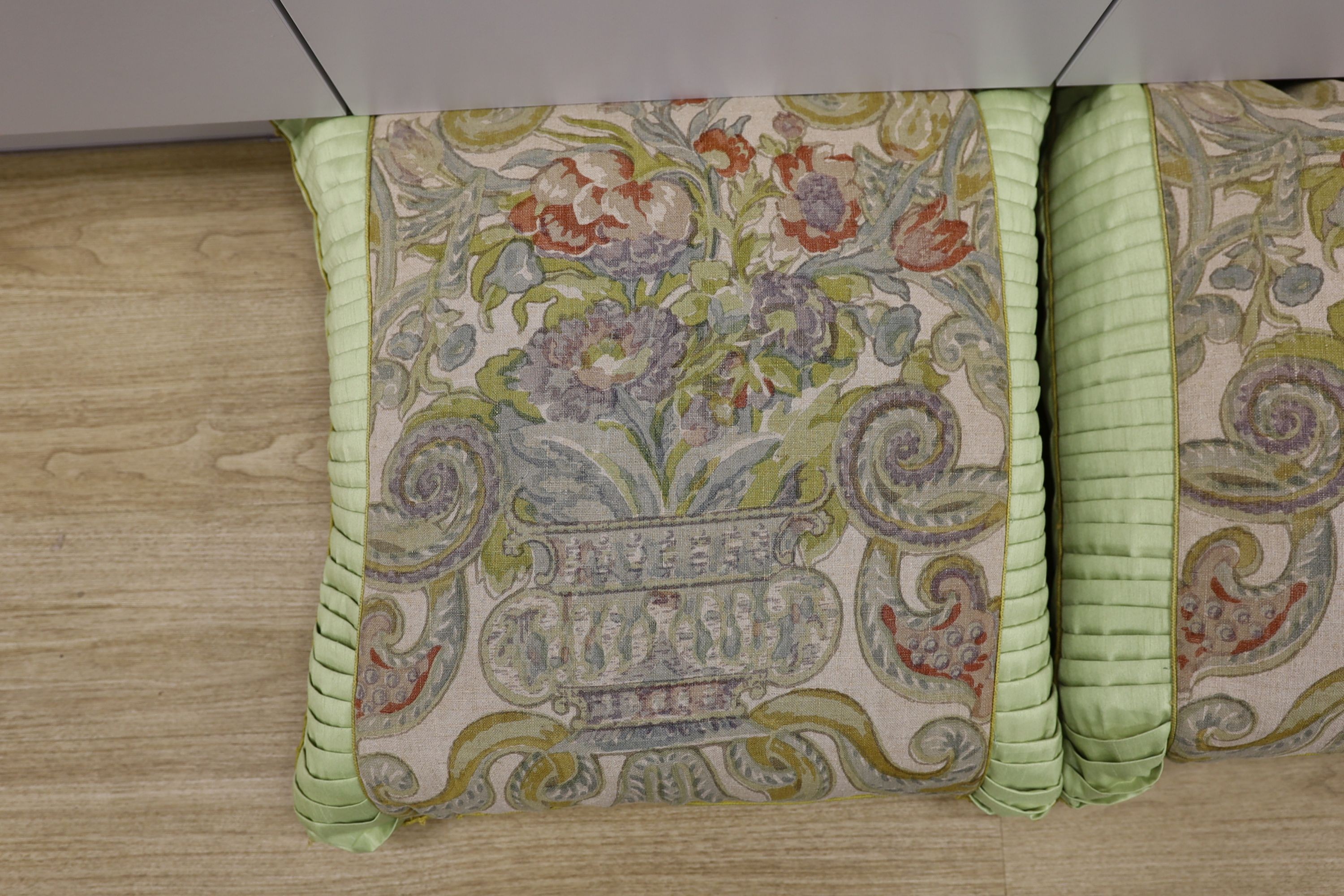 A pair of large fabric cushions